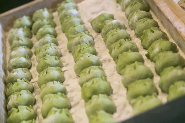 Tray of green dumplings