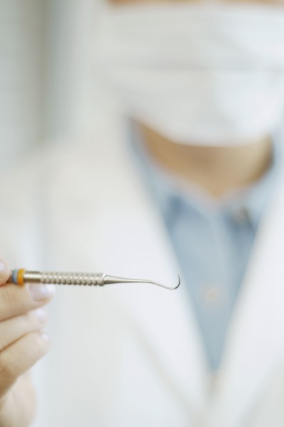 Close up of dental tool in dentist's hand