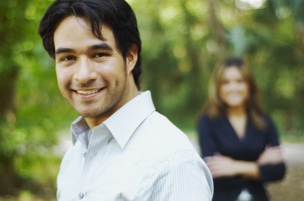 Hispanic businessman posing outdoors