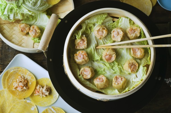 Asian dumpling in steamer with cabbage
