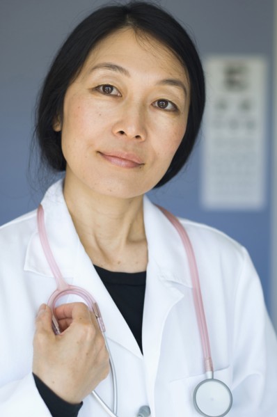 Japanese doctor standing in office