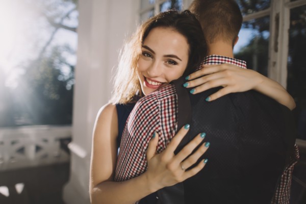 Smiling Caucasian couple hugging