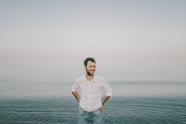 Caucasian man standing near ocean