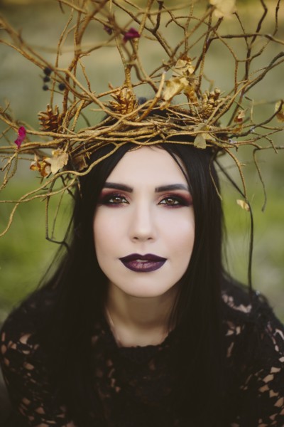 Gothic Caucasian woman wearing crown of branches