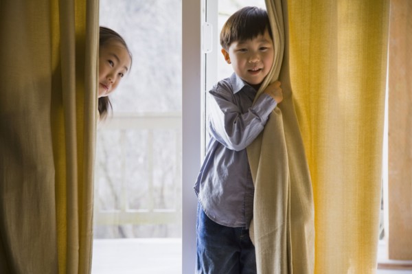 Korean children behind curtains