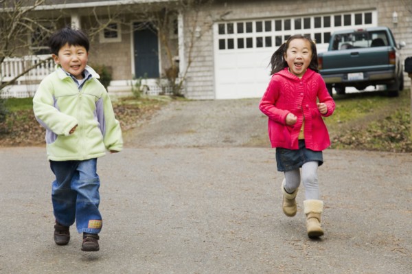 Korean children running in street
