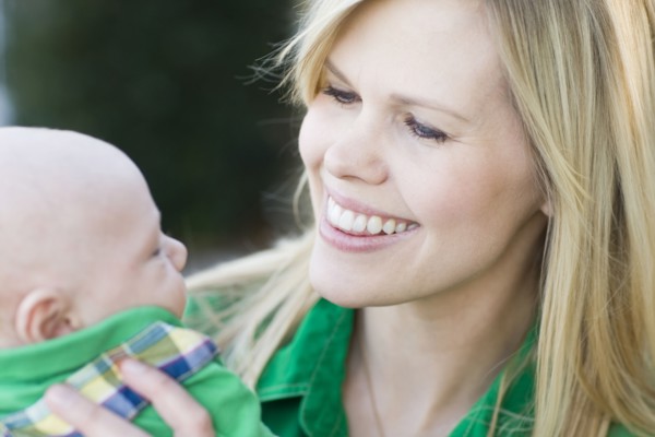 Caucasian mother holding baby