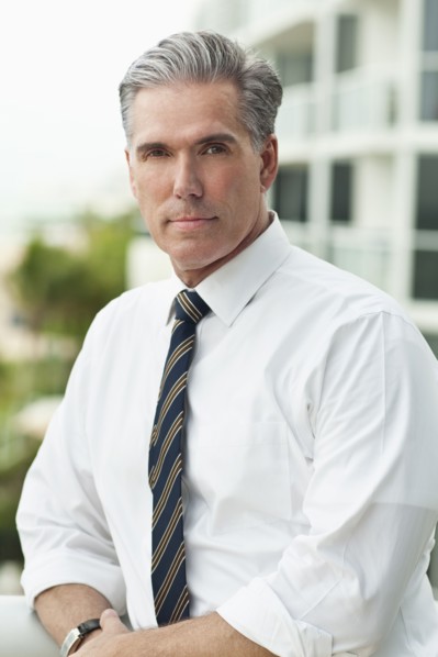 Close up of serious Caucasian businessman outdoors