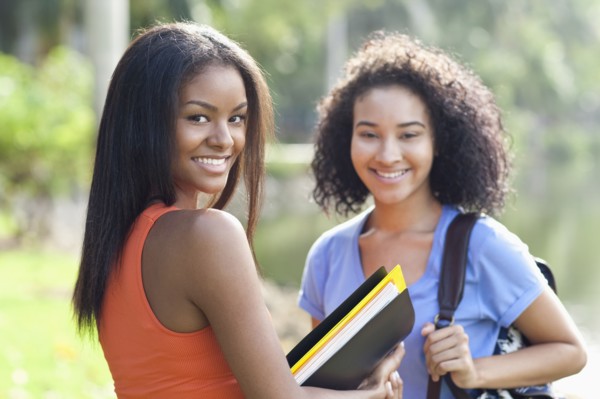 Black students smiling outdoors