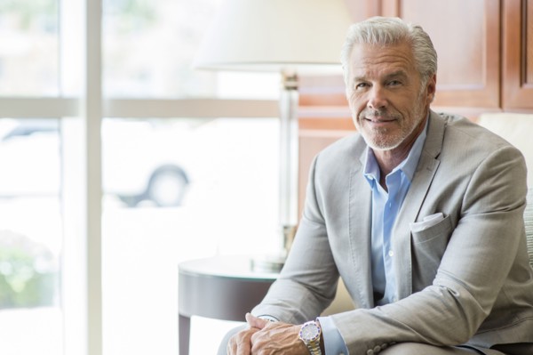 Caucasian man sitting near window