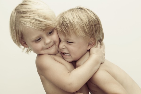 Caucasian boys wrestling