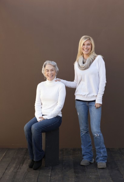 Caucasian mother and daughter smiling together