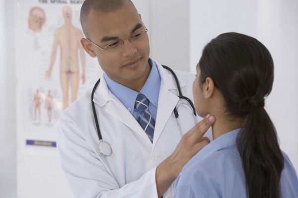 Male doctor examining patient