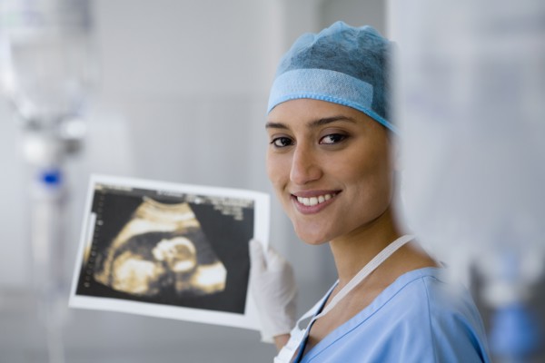 Female doctor holding sonogram