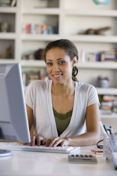 African American woman typing on computer