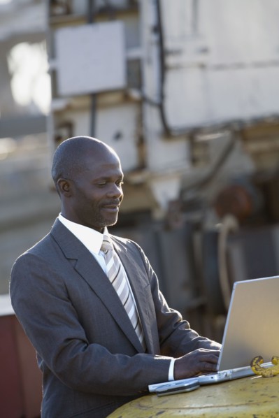African American businessman typing on laptop