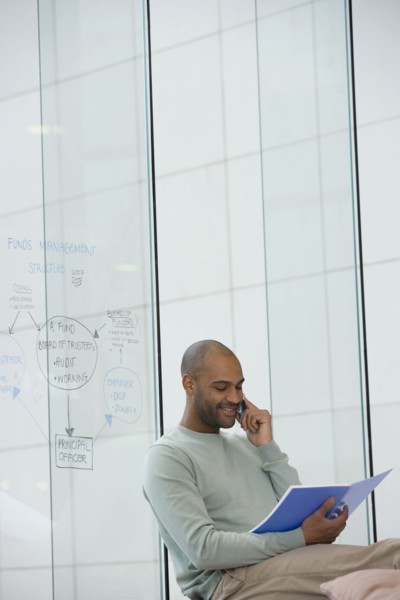 African businessman talking on cell phone