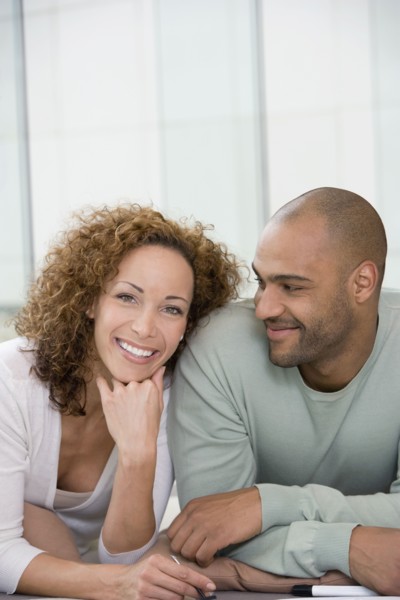 African couple laying on floor