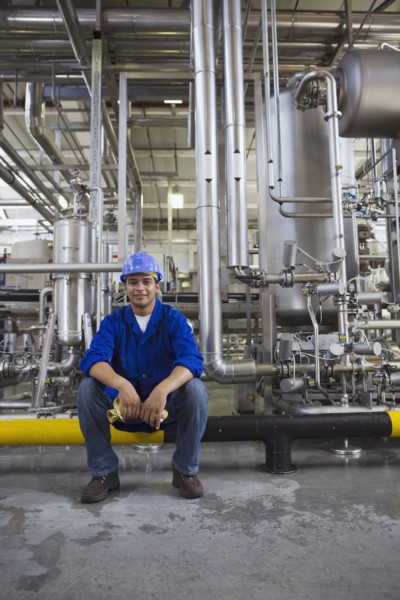 African worker sitting in factory