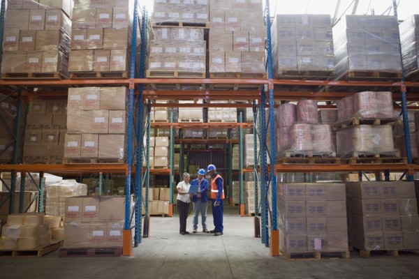 Workers talking in warehouse