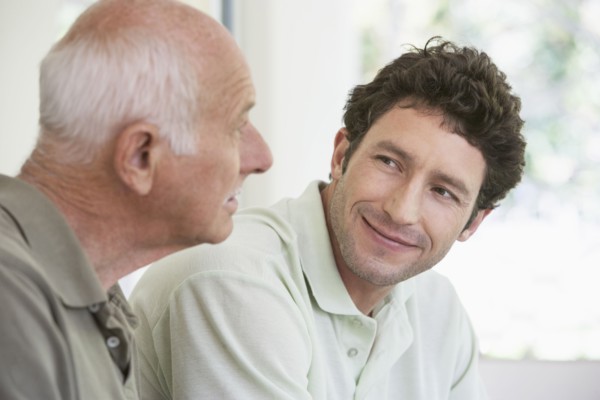 Caucasian father and son smiling