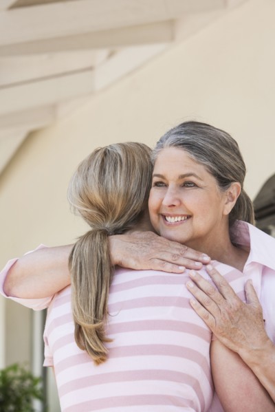 Caucasian mother and daughter hugging