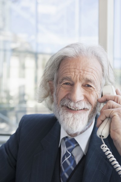 Senior Caucasian businessman talking on phone