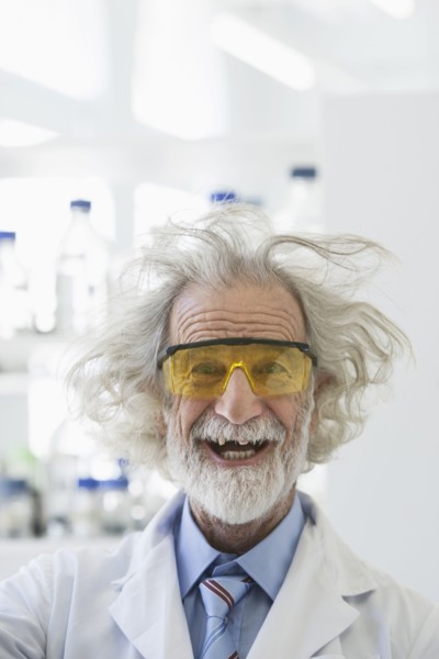Senior Caucasian scientist with unruly hair in lab