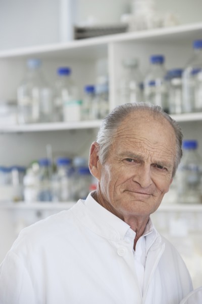 Senior Caucasian scientist working in lab