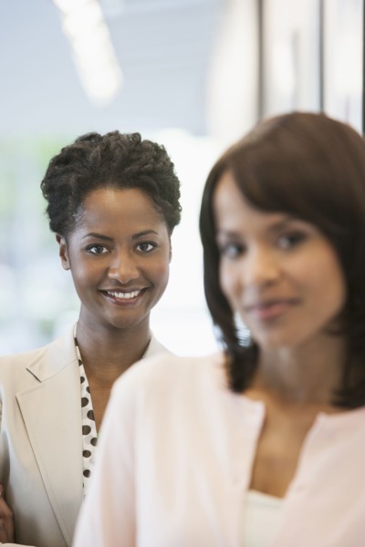 Businesswomen smiling in office