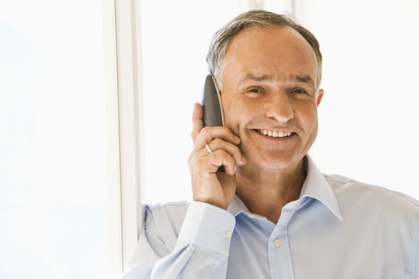 Businessman talking on phone in office