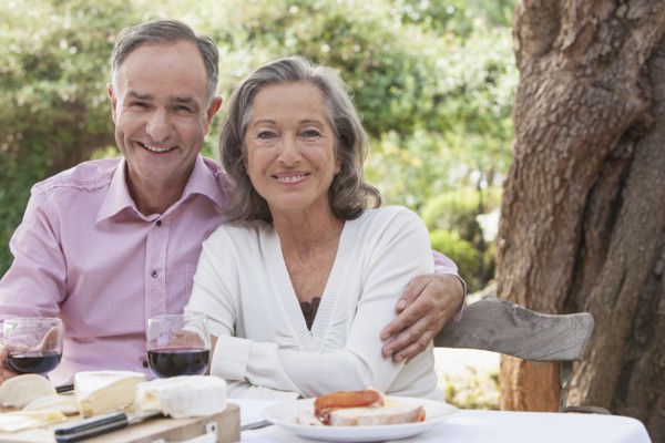 Couple eating together outdoors