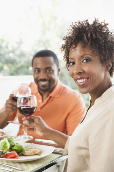 African American couple eating together