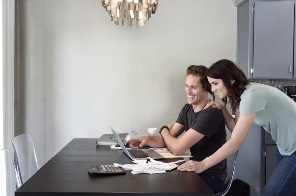 Caucasian couple using laptop