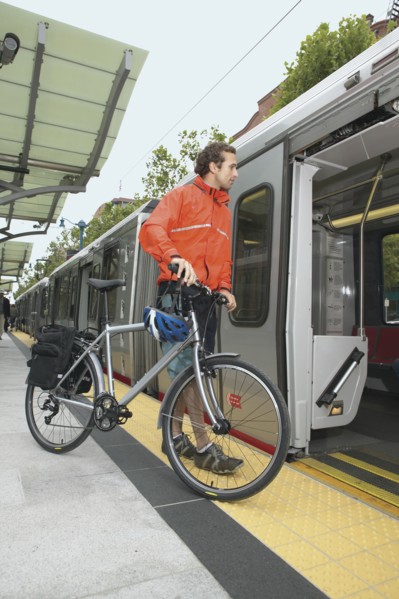 Man boarding subway with bike