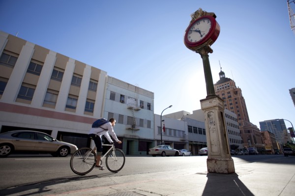 Bicycle messenger riding on city street