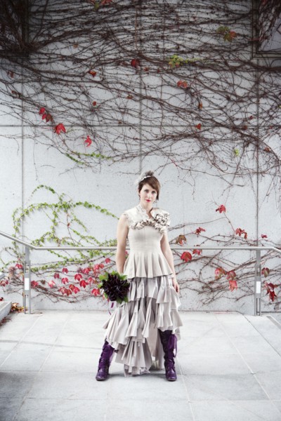Glamorous bride standing with bouquet