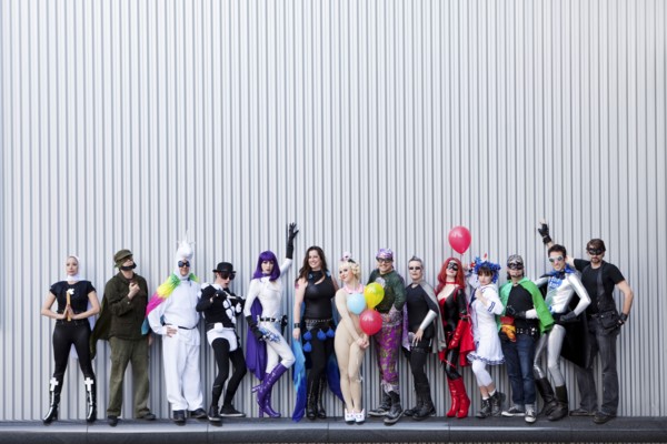 People dressed in superhero costumers