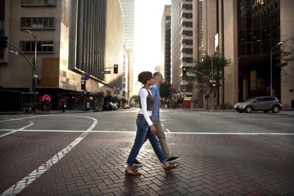 Couple crossing city street