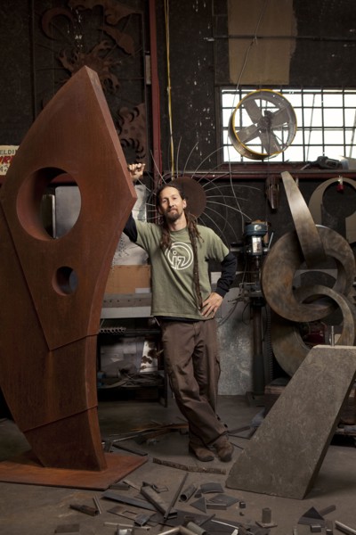 Caucasian artist standing in studio
