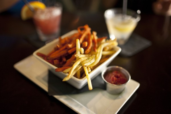Close up of bowl of french fries in restaurant