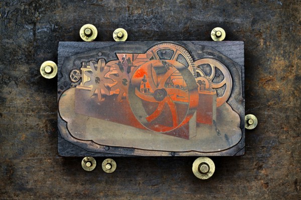 Close up of letter press wood block and gold weights