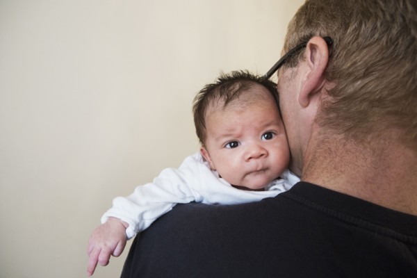 Close up of father holding mixed race baby
