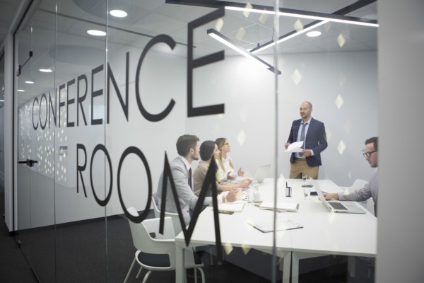 Caucasian business people talking in office meeting