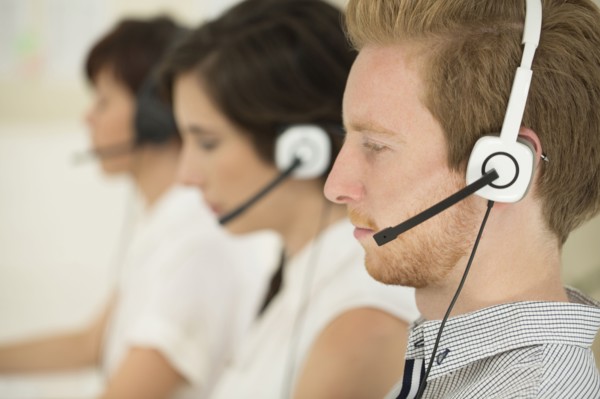 Close up of business people wearing headsets