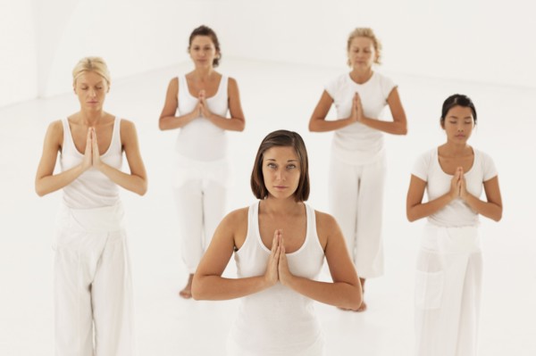 Women meditating in yoga class