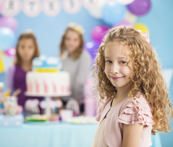 Girl smiling at birthday party