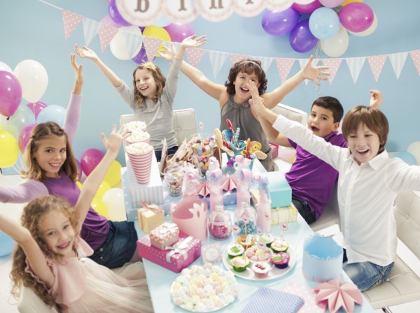 Children cheering at birthday party