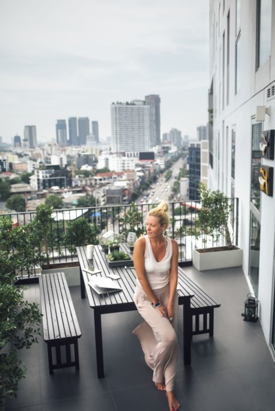 Caucasian woman standing on balcony