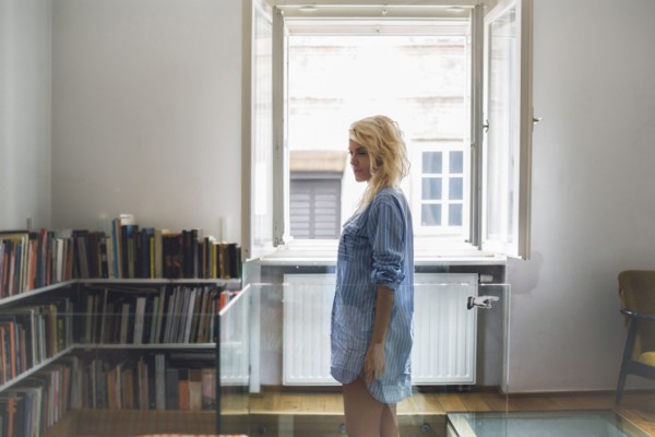 Woman standing in living room